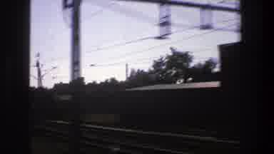 Stockholm Sweden (1975): Fast Train Travels Along Power Lines And Clouds