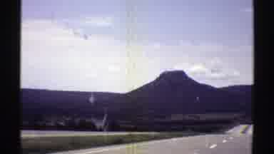 Arizona (1969): Driving On Highway Mountains The Background Scenic View