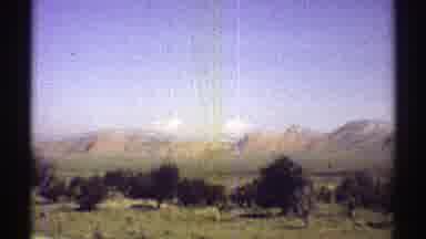 Arizona (1969): View Of Green Trees Brown Hills And Blue Sky In A Sunny Day