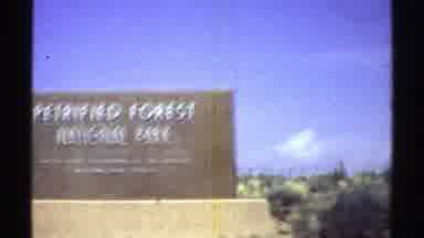 Arizona (1969): Car Driving By Sign Of National Park Looking Over Canyon