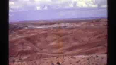 Arizona (1969): View Of Brown Hills Blue Sky And Small White Clouds