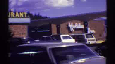 Arizona (1969): View Of White Holiday Inn Sign And Yellow Lettered Restaurant Sign