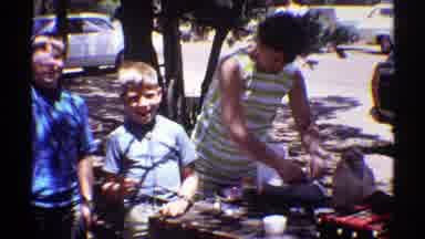 Arizona (1969): Mother With Her Children In The Backyard Setting A Table For A