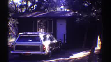 Arizona (1969): Two Boys Wearing Blue Shirts Run Towards Camera Waving Hands