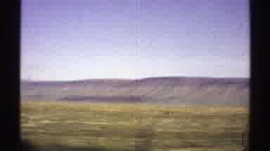 Arizona (1969): The View Of A Vast Land Edged By Long Mountain From A Moving