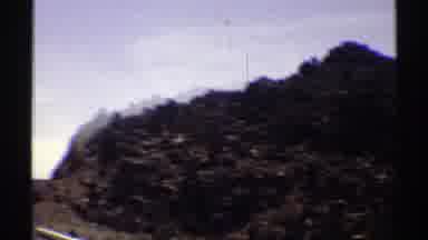 Arizona (1969): Passing View Of Brown Hills Mountain And Blue Sky On A Sunny Day