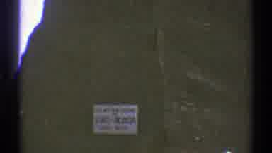 Arizona (1969): Vehicle Drives Past A Sign Welcoming Them To Nevada Among Rocks