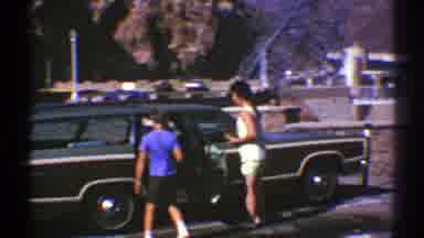 Arizona (1969): A Woman Dressed In Shorts Ushers A Boy Also Wearing Shorts Into A