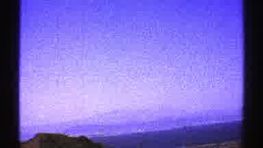 Arizona (1969): Mountains Off In The Distance And Near By Cars On A Street Cars
