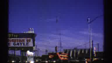 Arizona (1969): A Sunny Day In A Busy Urban Area With Trucks And Cars On The Roads