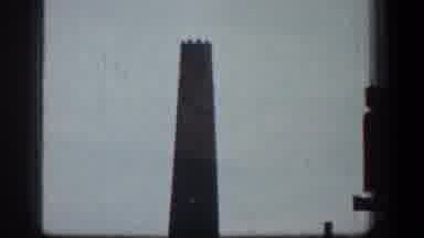 Baltimore Maryland (1961): A Building With A Protruding Tower Stands With Other