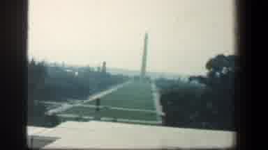 Baltimore Maryland (1961): An Obelisk And A Woman In Front Of A White Marble