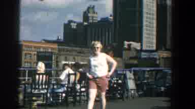 Baltimore Maryland (1961): Woman Wearing Red Shorts Walks To Small Girl Wearing