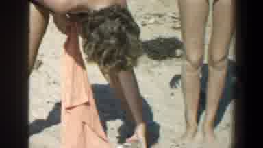 Baltimore Maryland (1961): Person Holding Orange Towel Looks At Brown Object In
