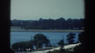 Baltimore Maryland (1961): View Of A River With Trees And A Hoard Near The
