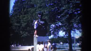 Baltimore Maryland (1961): Small Group Of People Surrounding A Statue With Several