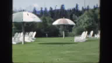 Montreal Canada (1950): View Of A Grass Garden With Parasol And White Chairs