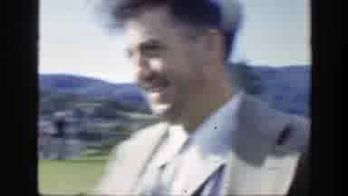 Montreal Canada (1950): Man In A Suit On The Grass Is Laughing