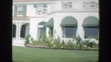 Montreal Canada (1950): Elderly Couple Walks Toward A White House With Green