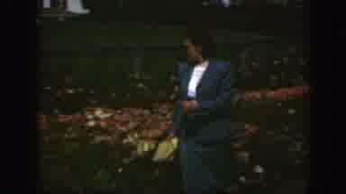 Montreal Canada (1950): A Lady With Sunglasses Walking Through A Yard Or A