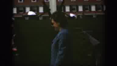 Montreal Canada-1950: Woman Wearing Blue Coat Walks On Lawn