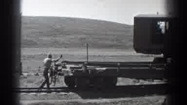 California (1936): A Worker Follows A Flat Railway Car And Applies The Rear Brake