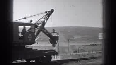California (1936): A Man Sits On A Train Track While Construction Is Going On