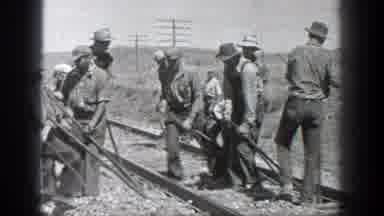 California (1936): Several Men Dressed In Uniforms And Hats Working On The Rails