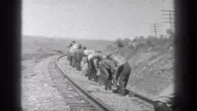 California (1936): Old Video With Several Men Building Train Tracks