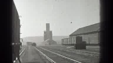 California (1936): Men Are Transported In A Vehicle On Rails