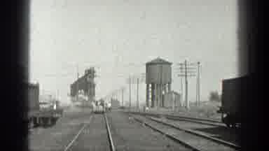 California (1936): View Of Industrial Area Cars Passing On The Track And Workers