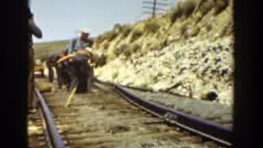 California (1936): A Group Of Workers Are Pushing The Railway Track And Trying To