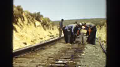 California (1936): Workers Transporting Heavy Metal Object