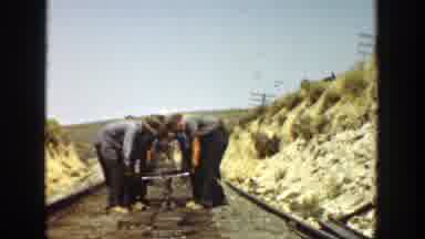 California (1936): A Group Of Workers Moving An Iron Rail While Building A Railway