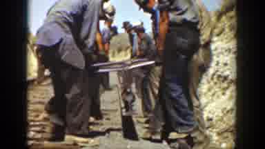 California (1936): A Group Of Workers Moving An Iron Rail Using Only Hand tools