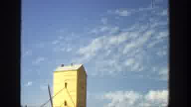 California (1936): A Yellow Building And A Beautiful Blue Sky In The Background
