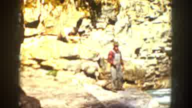 California (1936): Two People One Is Sitting On The Rocks The Other Is Standing