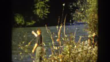 California (1936): Man Fishing On The Riverside Surrounded By Trees And Nature