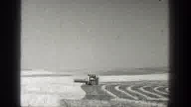 California (1936): View Grey Harvester Machine Harvesting Crops On A Clear Day