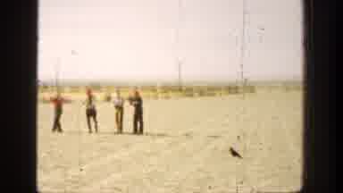California (1936): Four People On A Field With A Gun Shooting Something On The