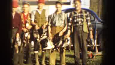 California (1936): Five Men Holding Ducks From Hunting Near A Car In An Open Field