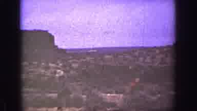 California (1936): Two Men With Guns In Their Hands Reach The Top Of A Hill With