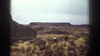 California (1936): Several People Walking In A Forest With Many Trees And