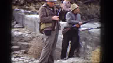 California (1936): Three Men Stand Near Grey Rocks Holding Rifles On A Clear Day