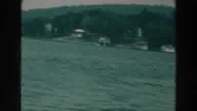 Lake Winnebago Wisconsin (1964): Man Sailing In The Sea With Houses Trees And