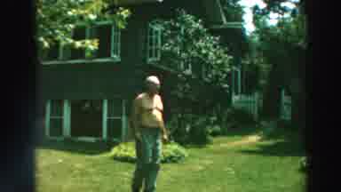 Lake Winnebago Wisconsin (1964): A Shirtless Man Noticing Camera And Walking