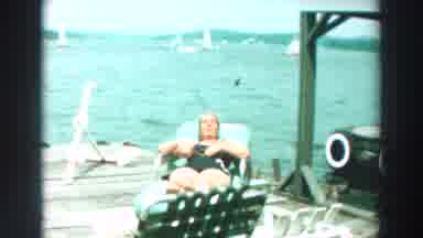 Lake Winnebago Wisconsin (1964): Two Men Greet Each Other And A Woman Sunbathes On