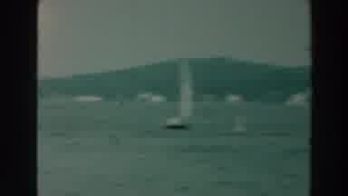 Lake Winnebago Wisconsin (1964): Small Sailboats Sail On A Lake With A Dock And