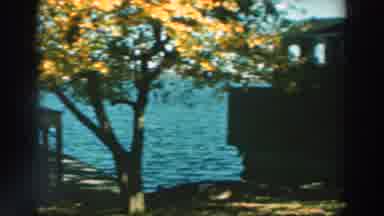 Lake Winnebago Wisconsin (1964): View Of Buildings And Boats By The Sea In Wooded