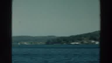 Lake Winnebago Wisconsin (1964): A Body Of Water Is Surrounded By Forested Hills